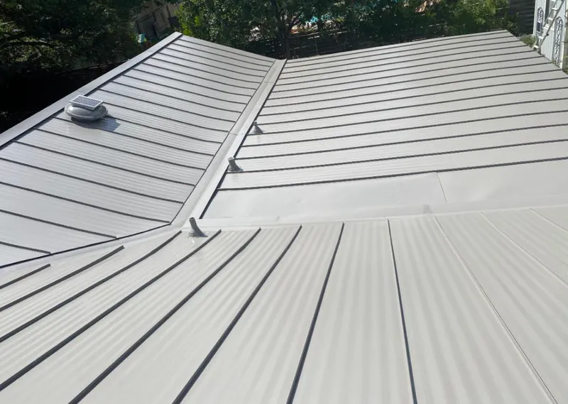 Solar attic fan installed on a metal roof for Roof Ventilation in Fruitville